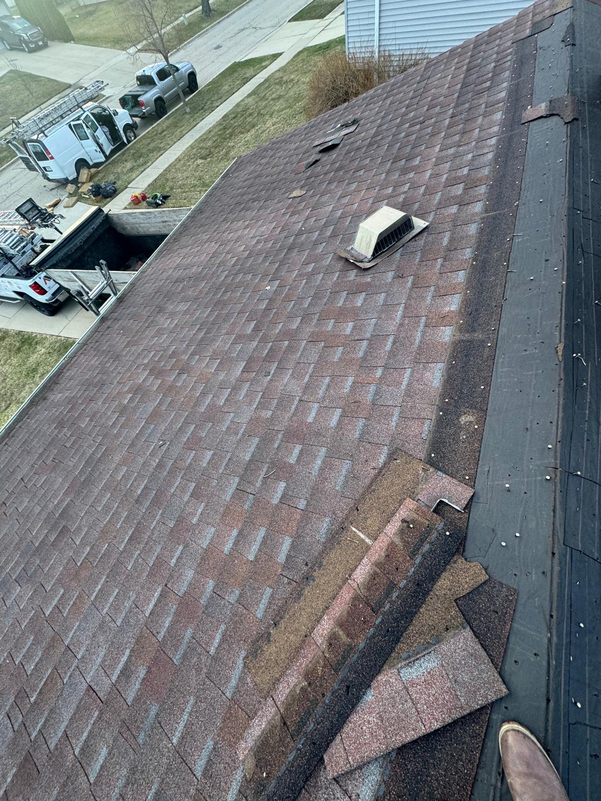 Old roof shingles documented before tear-off — roof replacement, storm damage roof repair, roof inspection, roof decking replacement, synthetic underlayment, completed roof installation, New Gen 180 LLC, Elgin IL, residential roofing