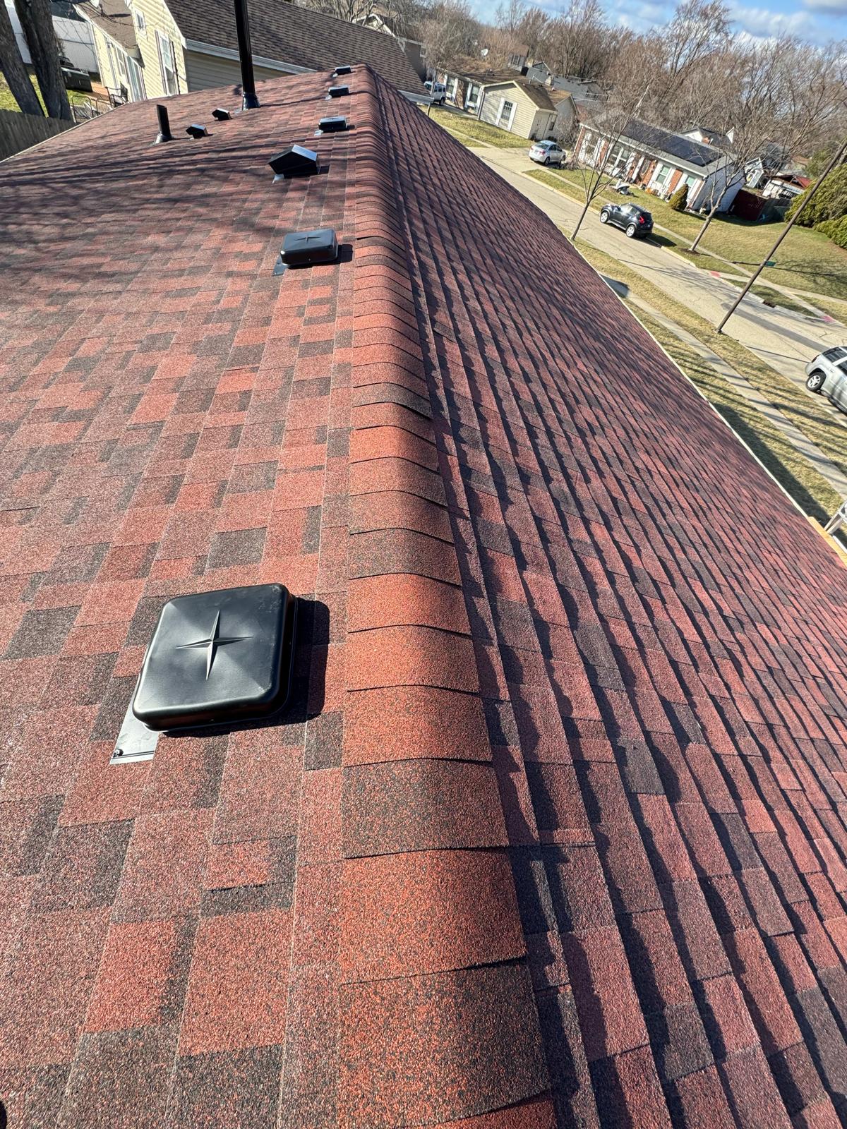 Completed roof with ridge vent and box vent — roof replacement, storm damage roof repair, roof inspection, roof decking replacement, synthetic underlayment, completed roof installation, New Gen 180 LLC, Elgin IL, residential roofing