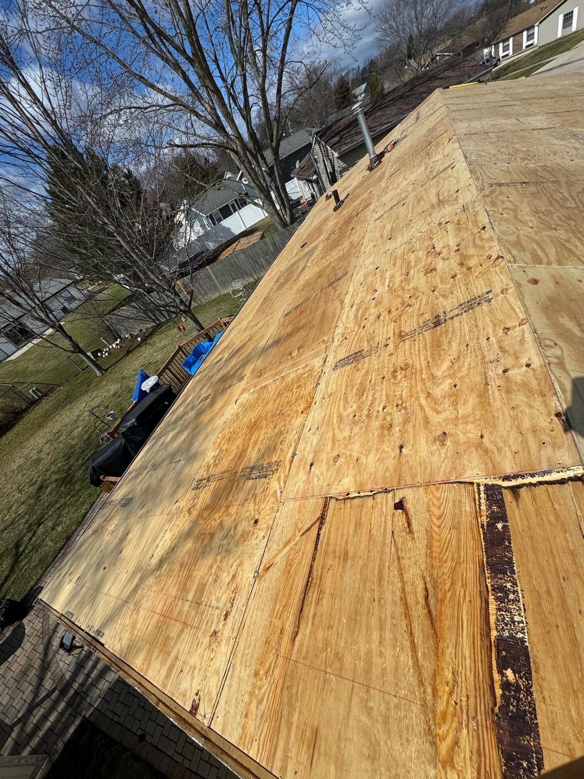 Roof decking replacement backyard view — roof replacement, storm damage roof repair, roof inspection, roof decking replacement, synthetic underlayment, completed roof installation, New Gen 180 LLC, Elgin IL, residential roofing