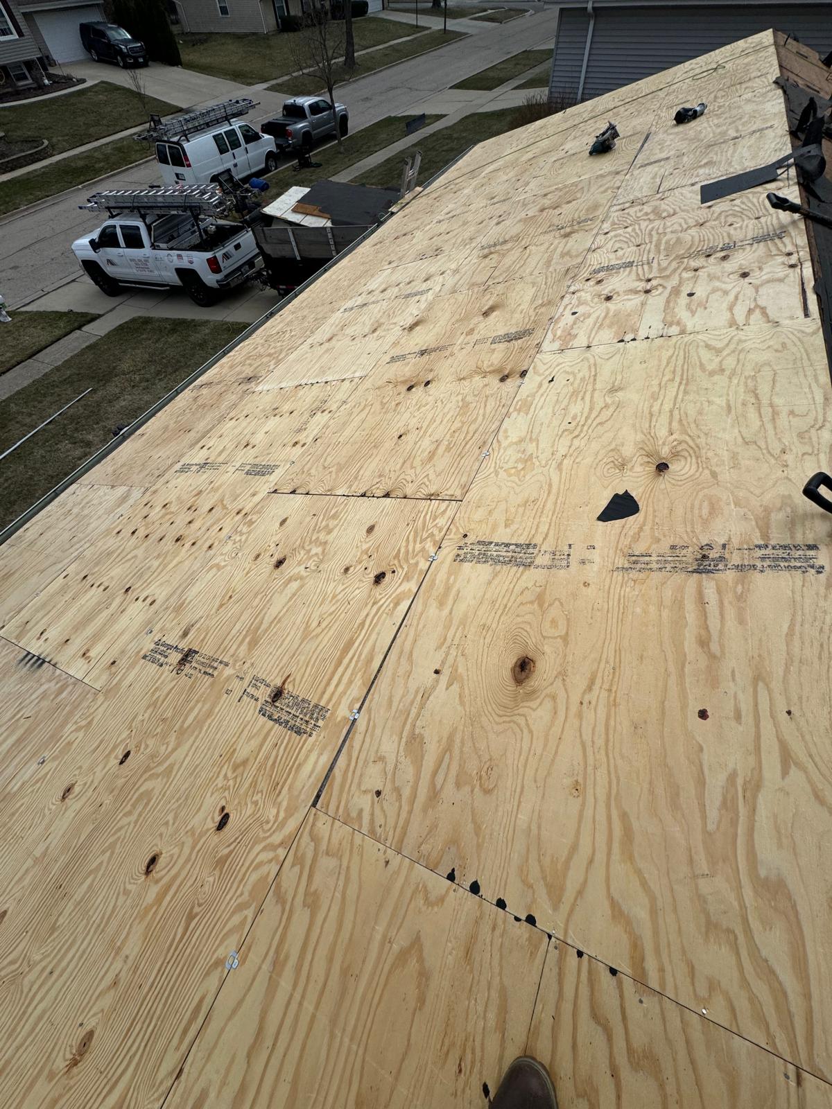 New plywood roof decking installed full slope — roof replacement, storm damage roof repair, roof inspection, roof decking replacement, synthetic underlayment, completed roof installation, New Gen 180 LLC, Elgin IL, residential roofing