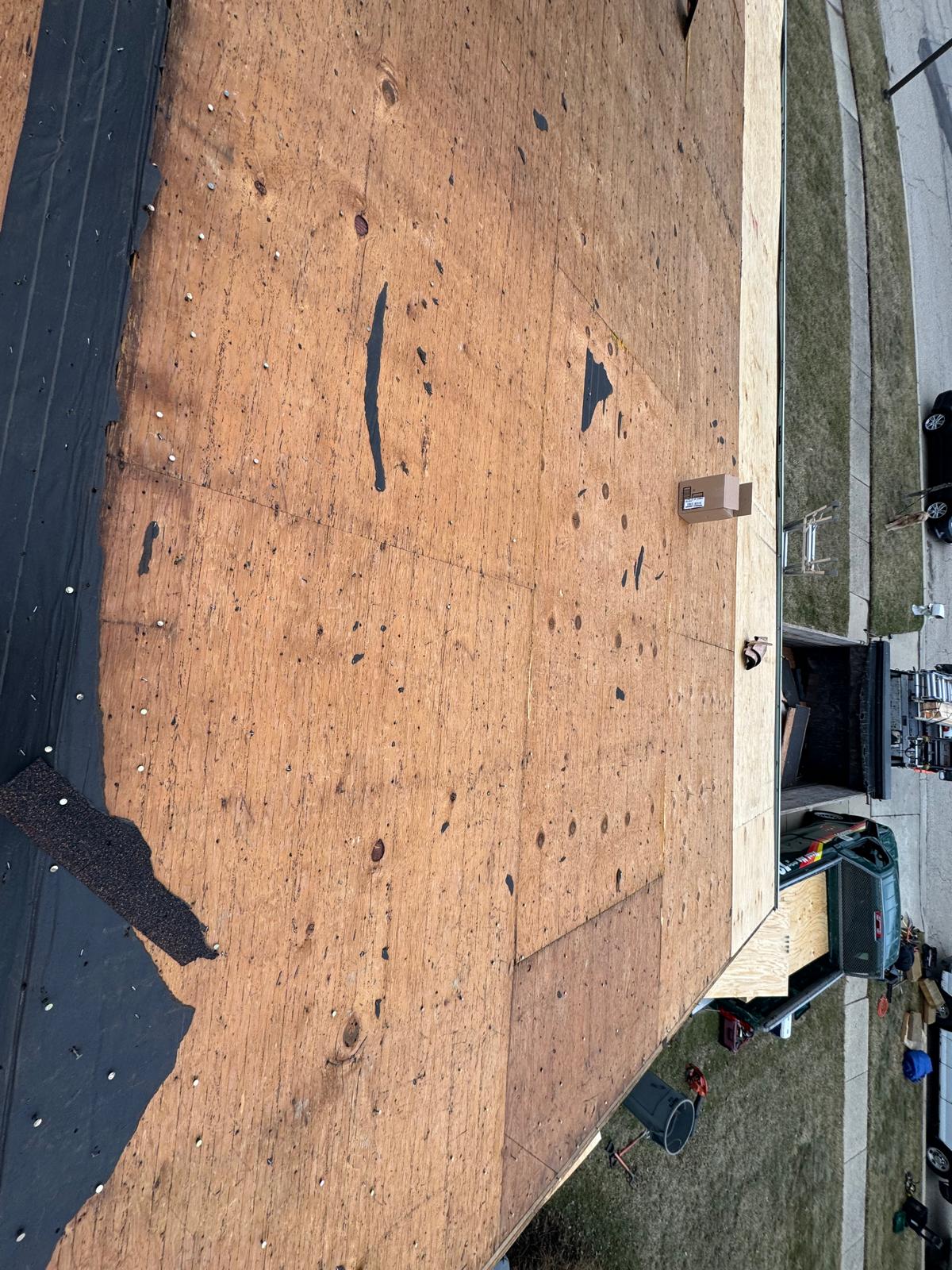 Original roof decking documented before replacement — roof replacement, storm damage roof repair, roof inspection, roof decking replacement, synthetic underlayment, completed roof installation, New Gen 180 LLC, Elgin IL, residential roofing