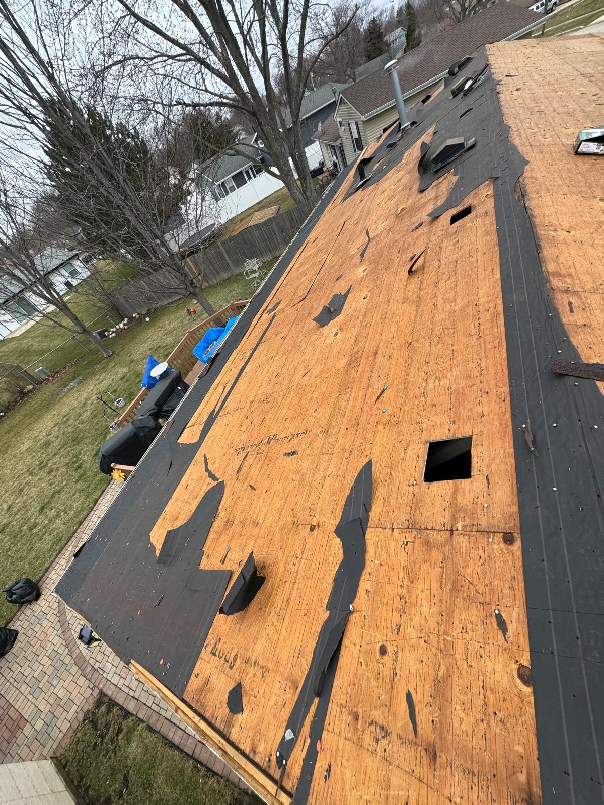 Roof tear-off exposing felt and decking — roof replacement, storm damage roof repair, roof inspection, roof decking replacement, synthetic underlayment, completed roof installation, New Gen 180 LLC, Elgin IL, residential roofing