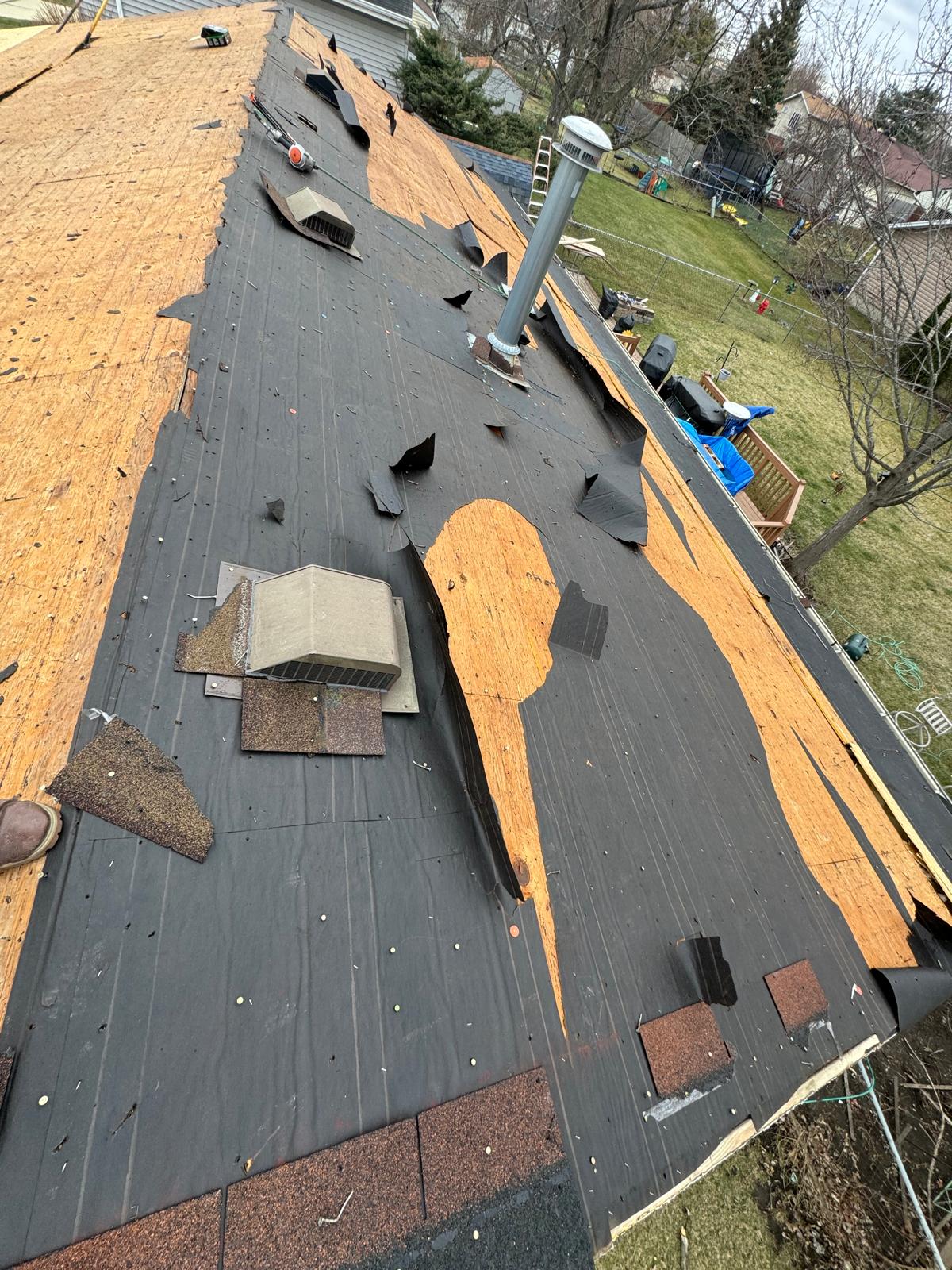 Roof tear-off in progress around vents — roof replacement, storm damage roof repair, roof inspection, roof decking replacement, synthetic underlayment, completed roof installation, New Gen 180 LLC, Elgin IL, residential roofing