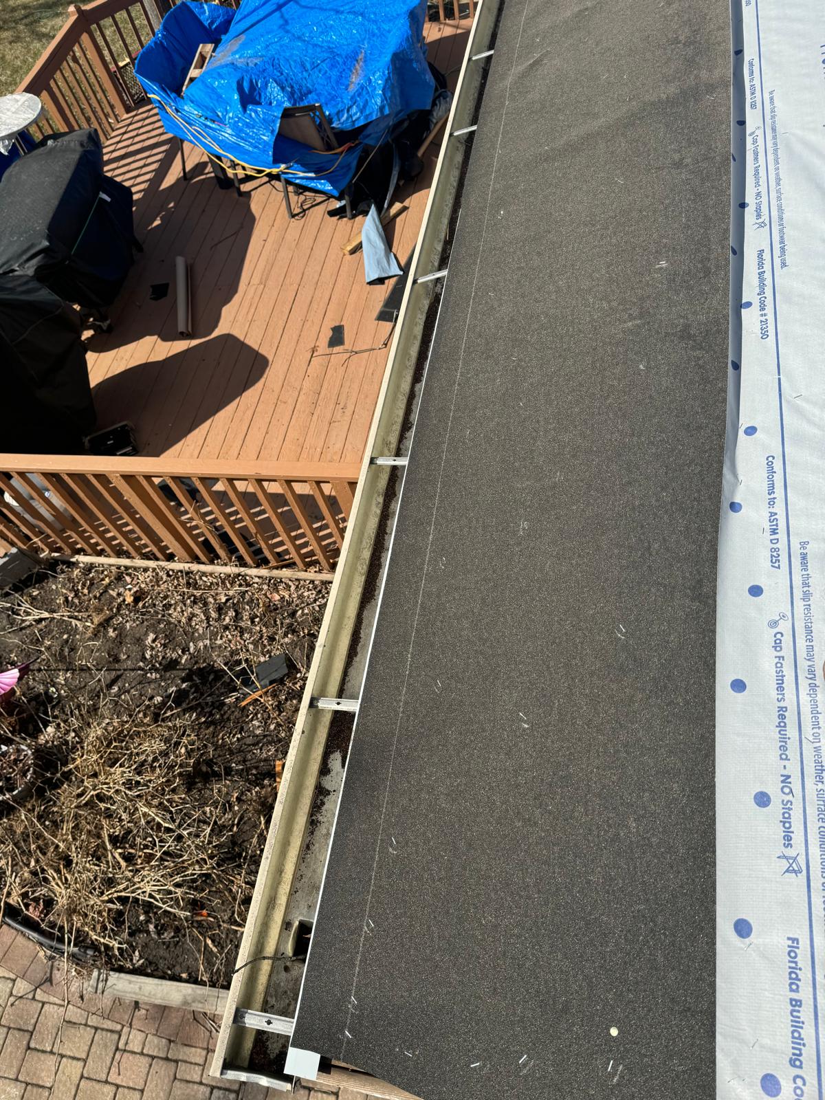 Ice and water shield protection at eaves — roof replacement, storm damage roof repair, roof inspection, roof decking replacement, synthetic underlayment, completed roof installation, New Gen 180 LLC, Elgin IL, residential roofing